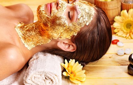Woman Getting Gold Facial Mask