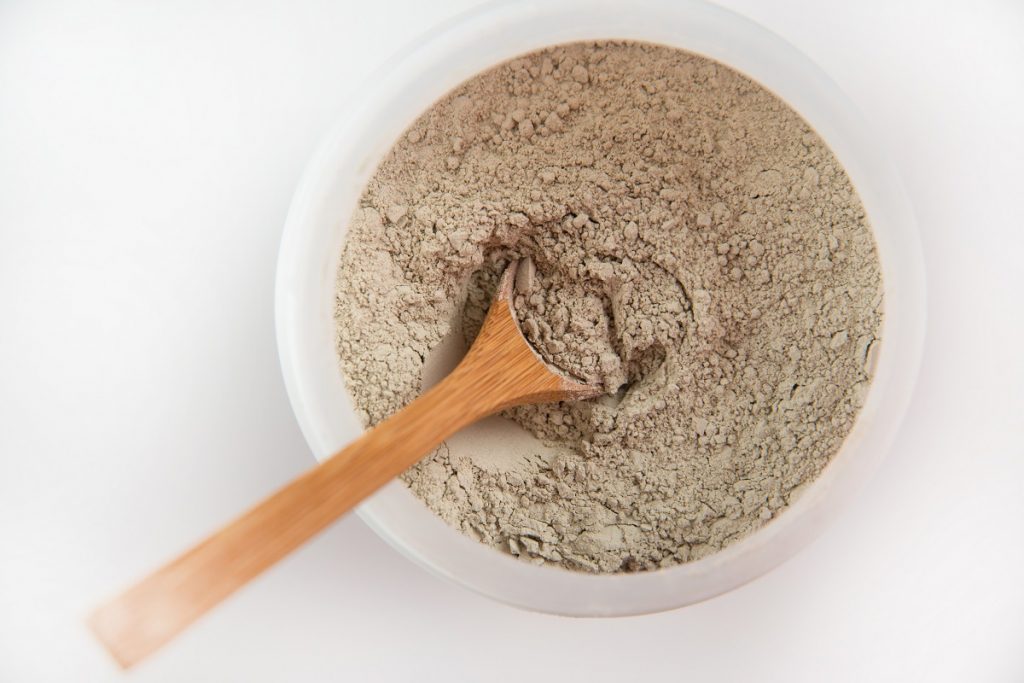 fine powder in a bowl with wooden spoon